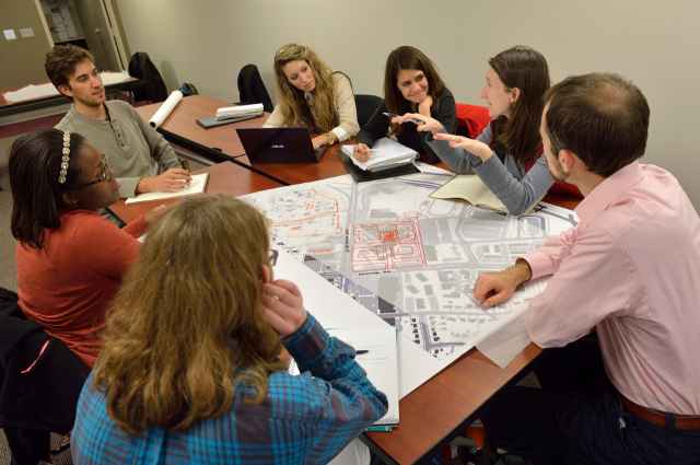 Graduate students in the National Capital Region attend class with peers via teleconferencing