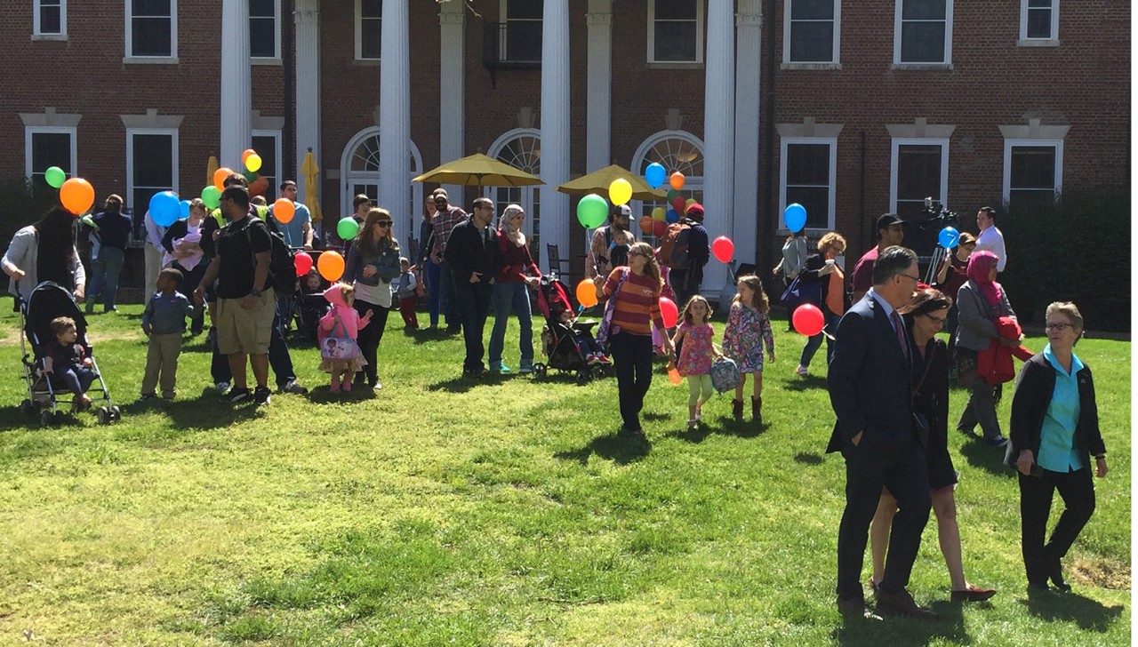 Families and their children on the Graduate School lawn