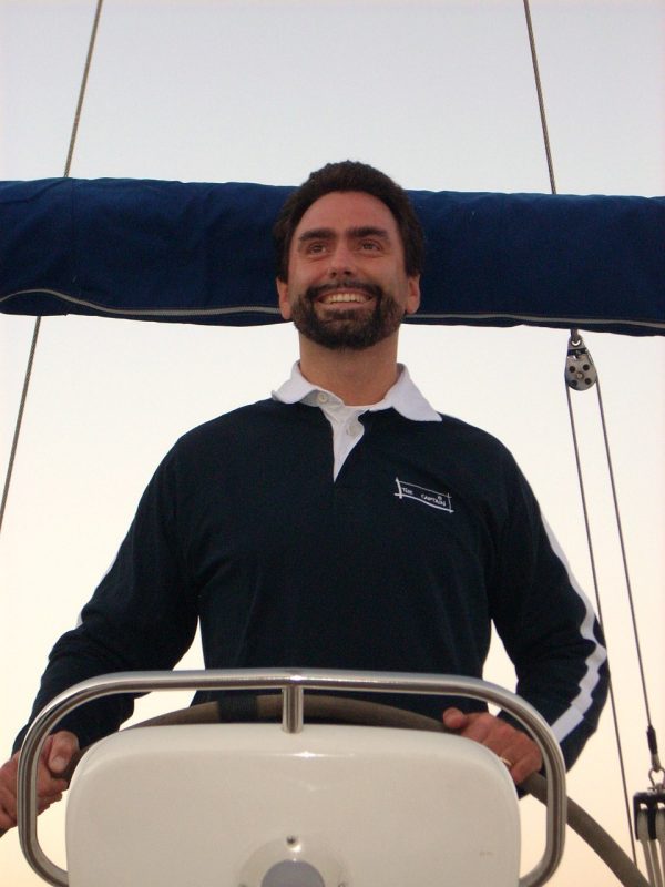 Photo of Stefano Brizzolara at the helm of a boat