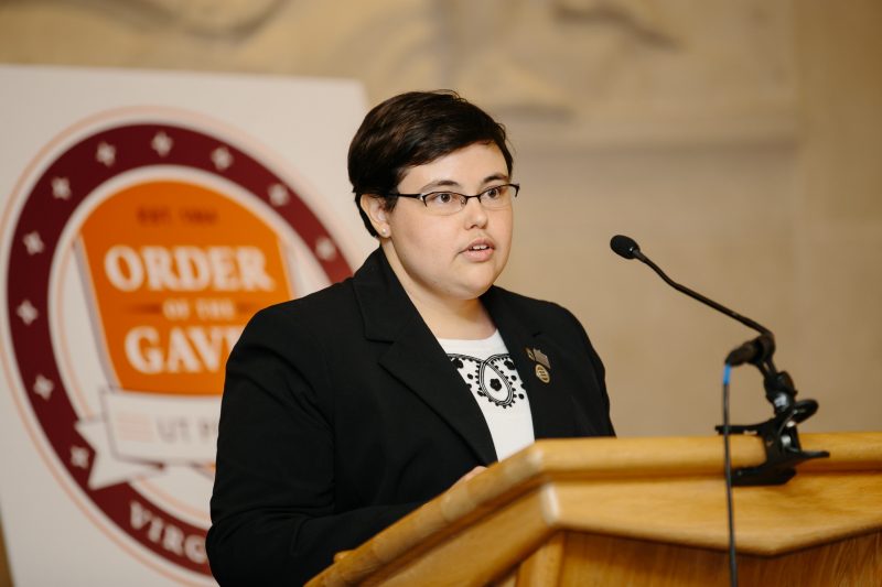 Erin Lavender-Stott talks at a podium at an Order of the Gavel gathering