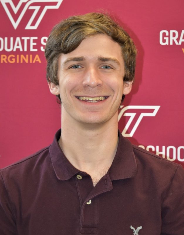 Will Hutton smiling in front of a Virginia Tech backdrop