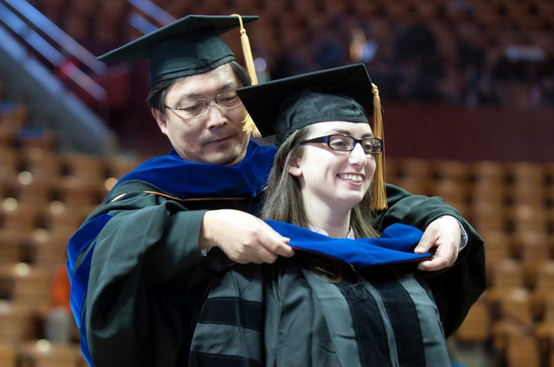 A PhD student receiving her hood