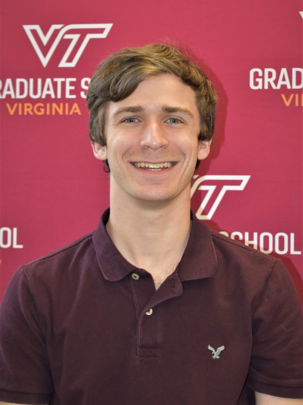 Will Hutton smiling in front of a Virginia Tech backdrop
